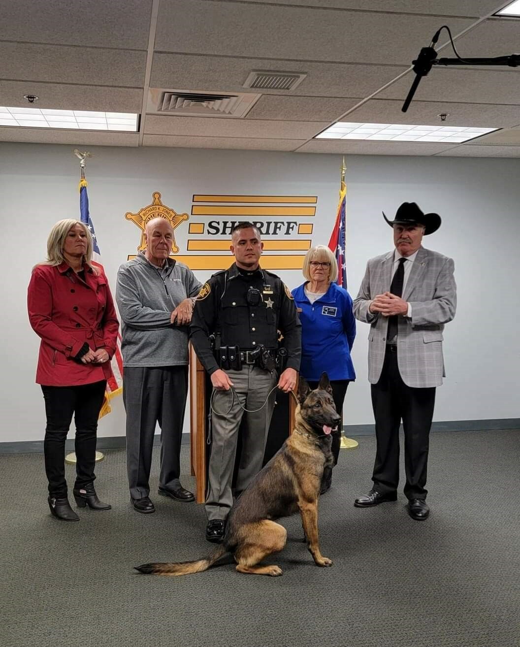 A Sheriff with a group of people and Boris the K9